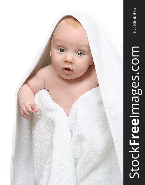 Tot under towel on white background.