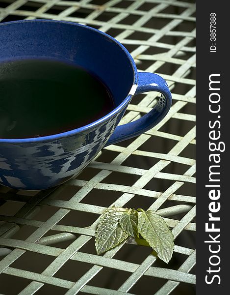 Closeup picture of a cup of fresh mint tea. Closeup picture of a cup of fresh mint tea