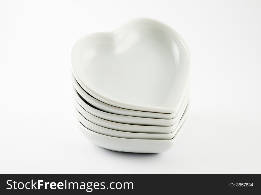Stack of pottery hearts isolated on a white background