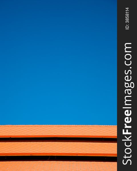 Blue sky orange roof tiles of abstract colors and lines. Blue sky orange roof tiles of abstract colors and lines