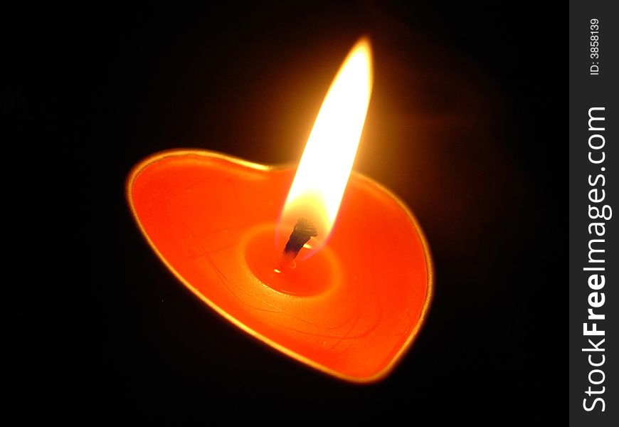 Red Heart candle in the dark