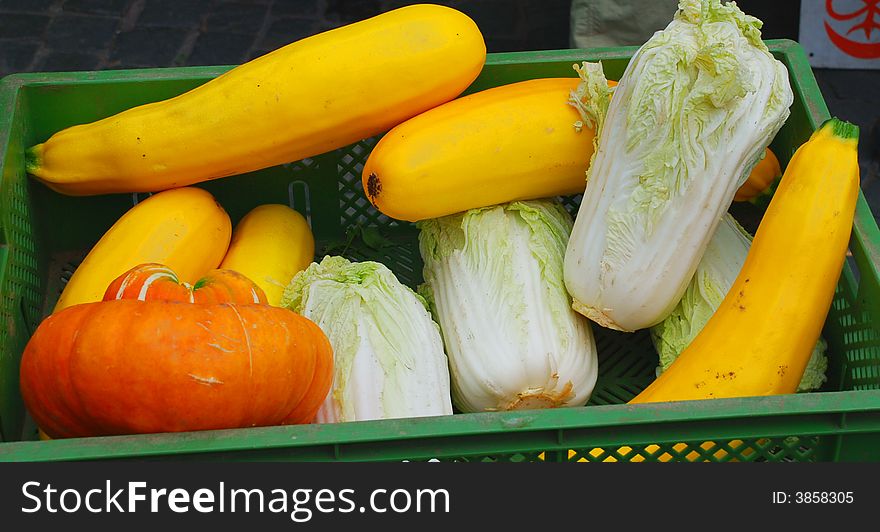 Pumpkins and cabbage in a basket