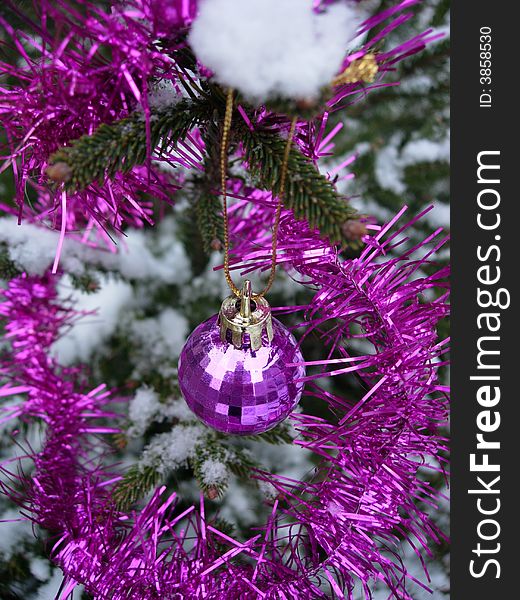 Pink christmas ball - christmas tree under snow