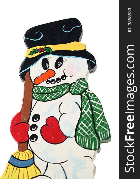 A wood carved colorful snowman isolated over white. A wood carved colorful snowman isolated over white