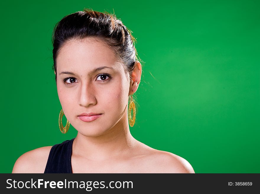 Alluring look of a young woman in black single strap top. Alluring look of a young woman in black single strap top