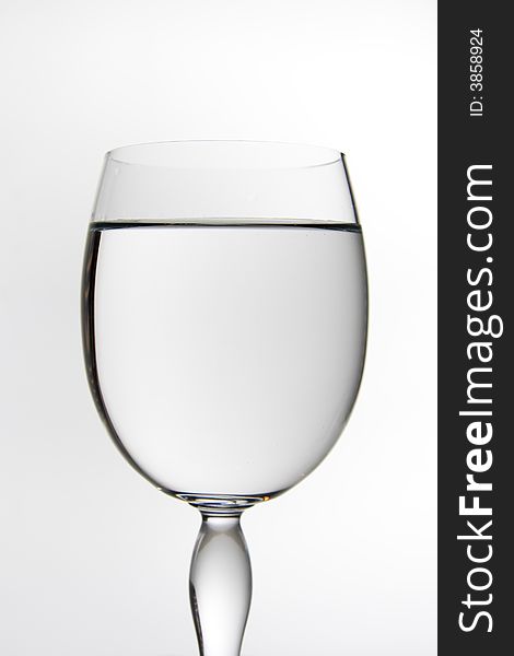 A wine glass full of water. A wine glass full of water