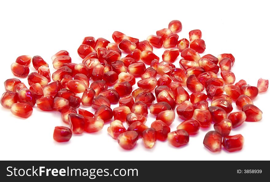 Pomergrenates: full, sliced and seeds isolated on white background. Pomergrenates: full, sliced and seeds isolated on white background