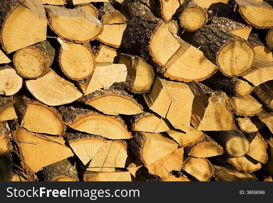 Dry yellow pile of logs stacking abreast. Dry yellow pile of logs stacking abreast