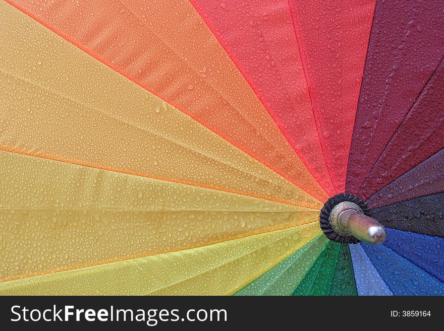 Close up from a wet umbrella as background