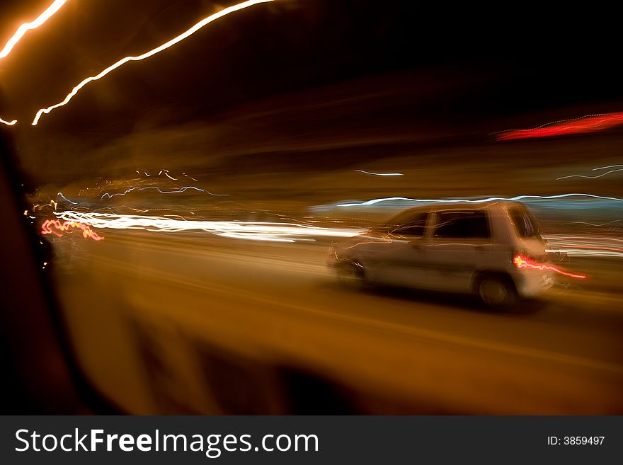 Moving abstract lights from inside a car. Moving abstract lights from inside a car