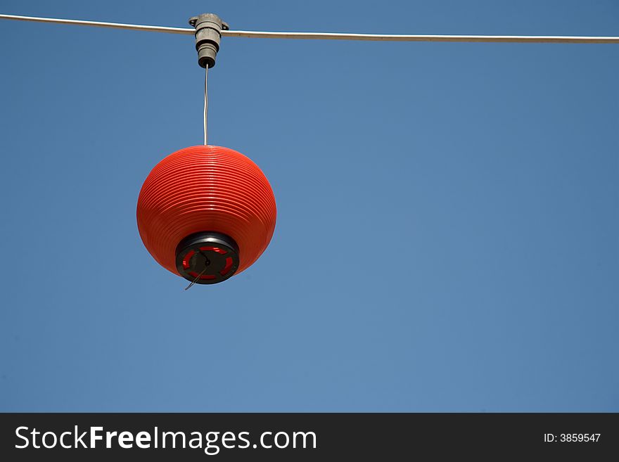 Single chinese hanging lantern on blue background with copy space. Single chinese hanging lantern on blue background with copy space