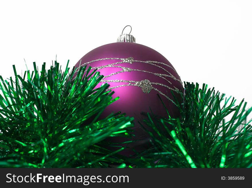 Lilac fur-tree toy on green garland