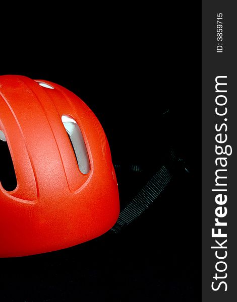 An orange childs bike helmet