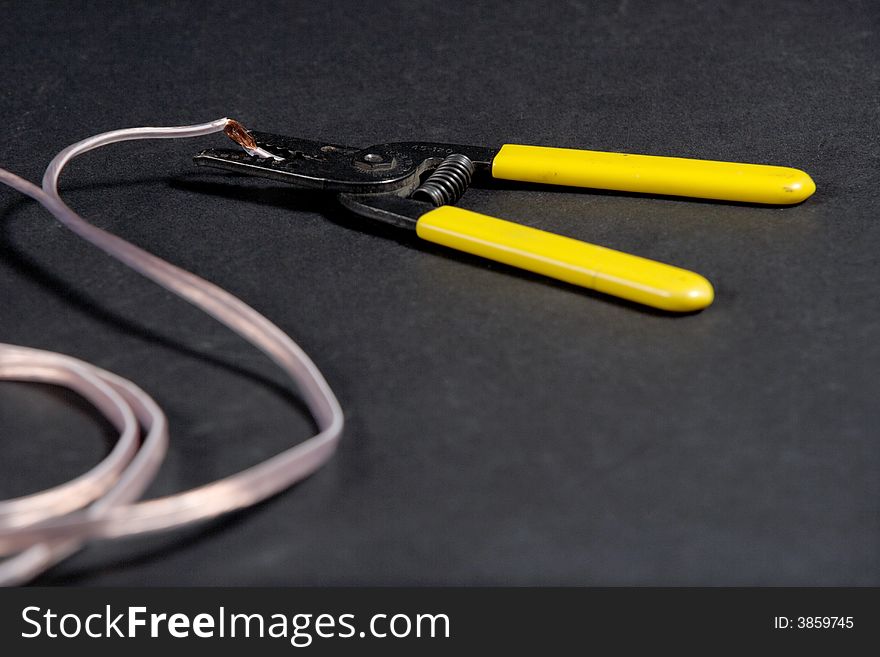 Wire strippers stripping some copper wire