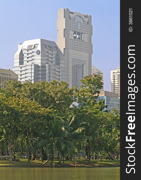 Modern office blocks with a lush tropical park in the foreground. Modern office blocks with a lush tropical park in the foreground