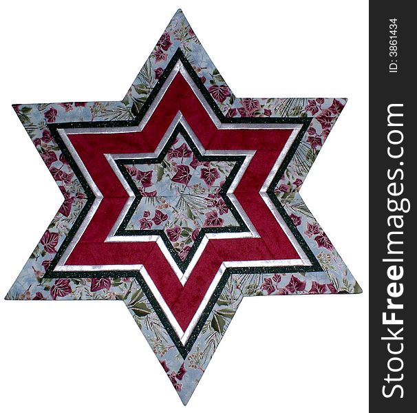 Patchwork Star made of cloth with Christmas patterns. Patchwork Star made of cloth with Christmas patterns.