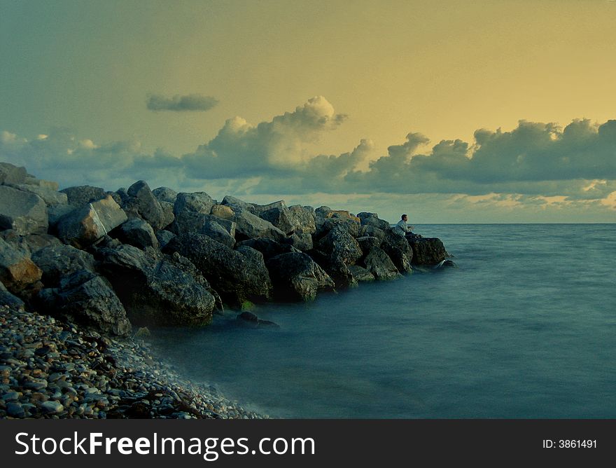 The sky the sea and clouds the person on fishing. The sky the sea and clouds the person on fishing