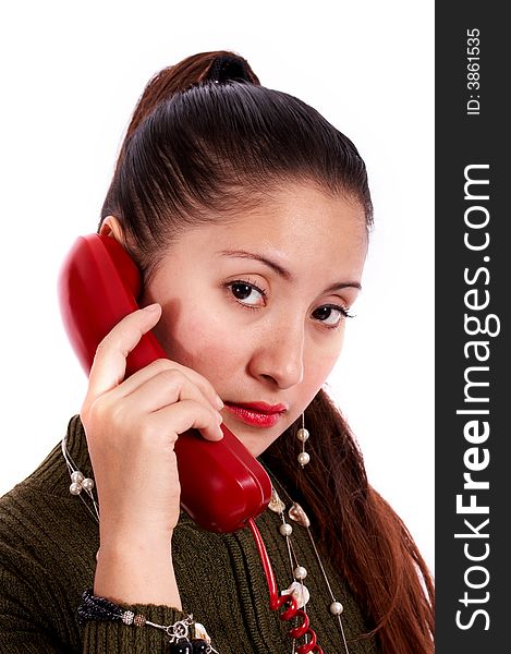 A young beautiful female talking on the phone. A young beautiful female talking on the phone