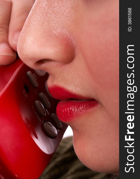 Close-up of a young female talking on the phone. Close-up of a young female talking on the phone