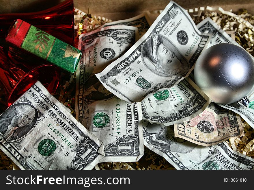 Money in many denominations with some wrapping paper. Money in many denominations with some wrapping paper