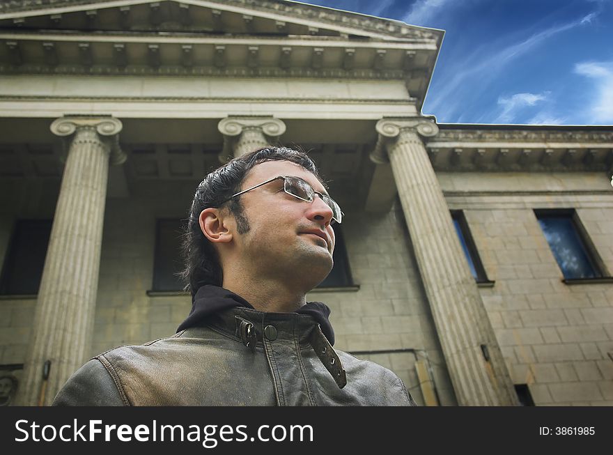 Portrait of the man on a background of a building