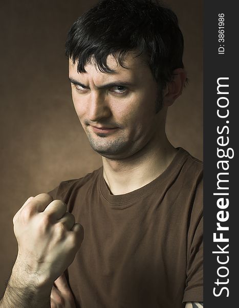 The man threatening by a fist close up