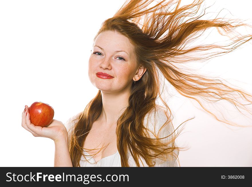 The beautiful girl with an apple on a white background