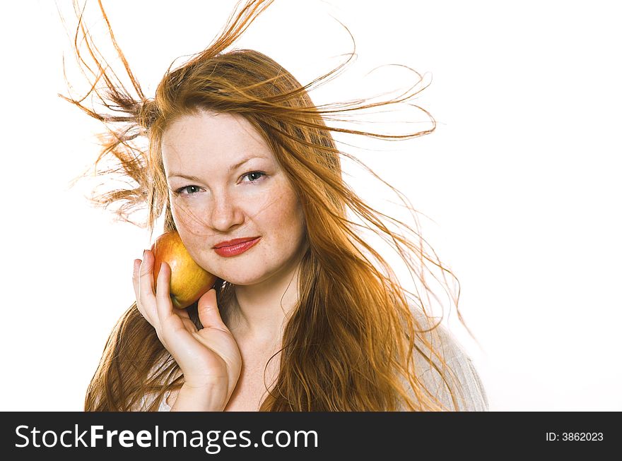 The beautiful girl with an apple on a white background