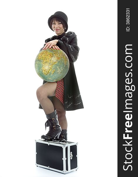 Beautiful brunette with valise and globe on isolated background
