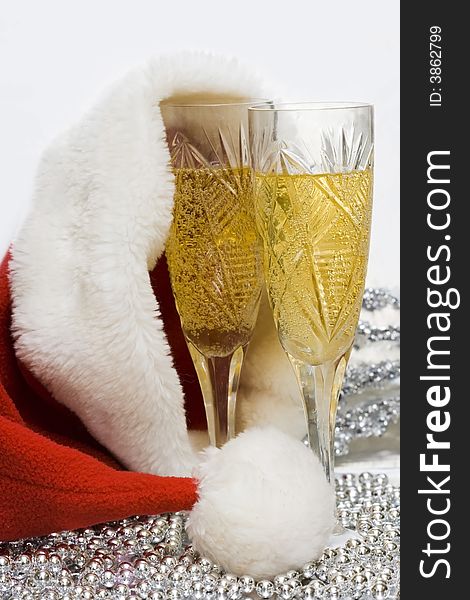 Glasses with champagne with Santa hat