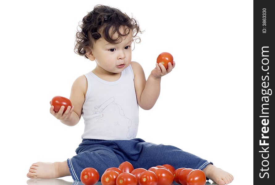 Child with tomato,isolated on a white background. Child with tomato,isolated on a white background.