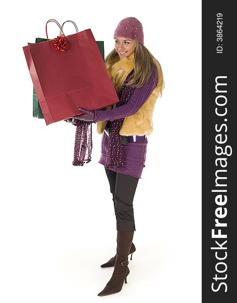 Young woman holding shopping bags. White background, front view. Young woman holding shopping bags. White background, front view.