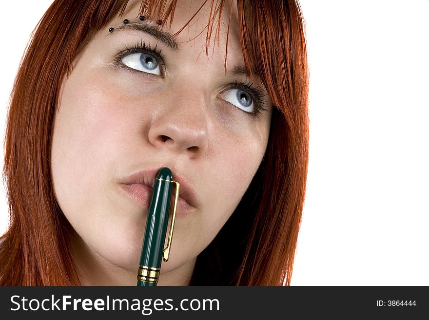 Cute girl with redhair pensive with pen on her lips. Cute girl with redhair pensive with pen on her lips.