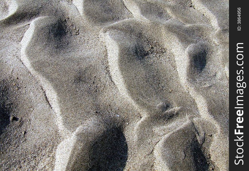 Print of a river on the sand