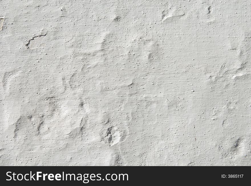 Detail of a rugged white wall suitable as background
