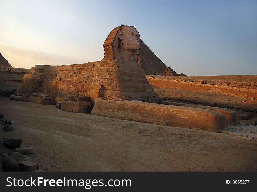 Sphinx on background of the egyptian pyramid