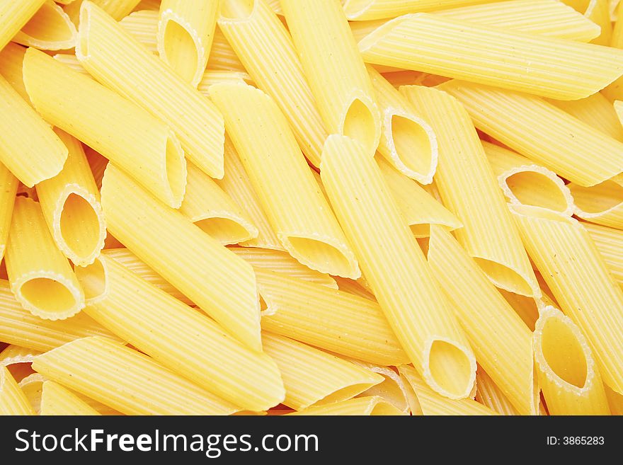 Uncooked yellow noodle , kitchen background. Uncooked yellow noodle , kitchen background