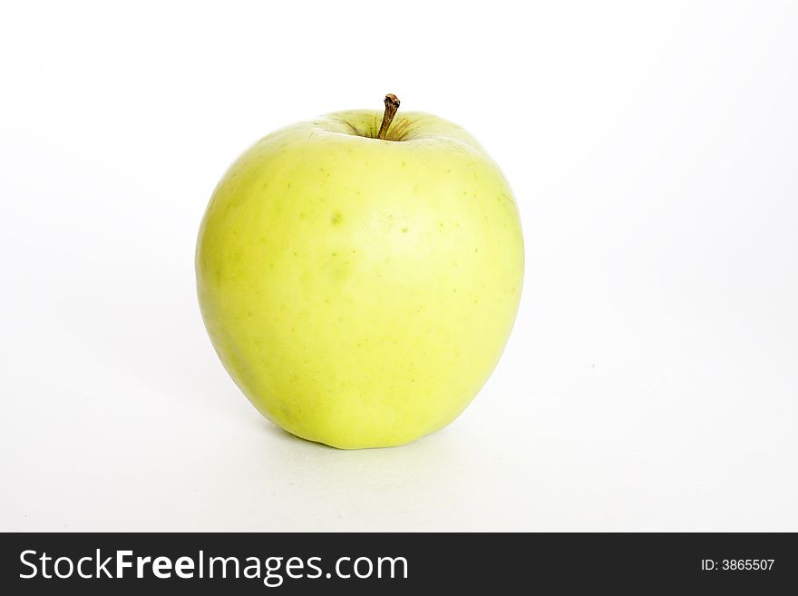 Sweet green apple on the neutral background