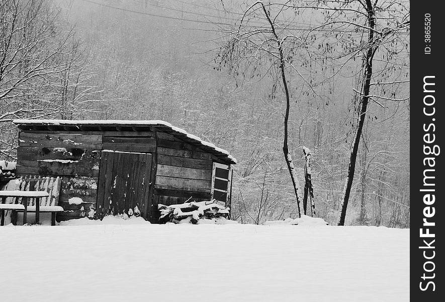 Old wooden hut and snow in the nature ambient. Old wooden hut and snow in the nature ambient