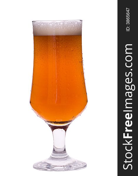 Glass of beer with foam isoleted over white background