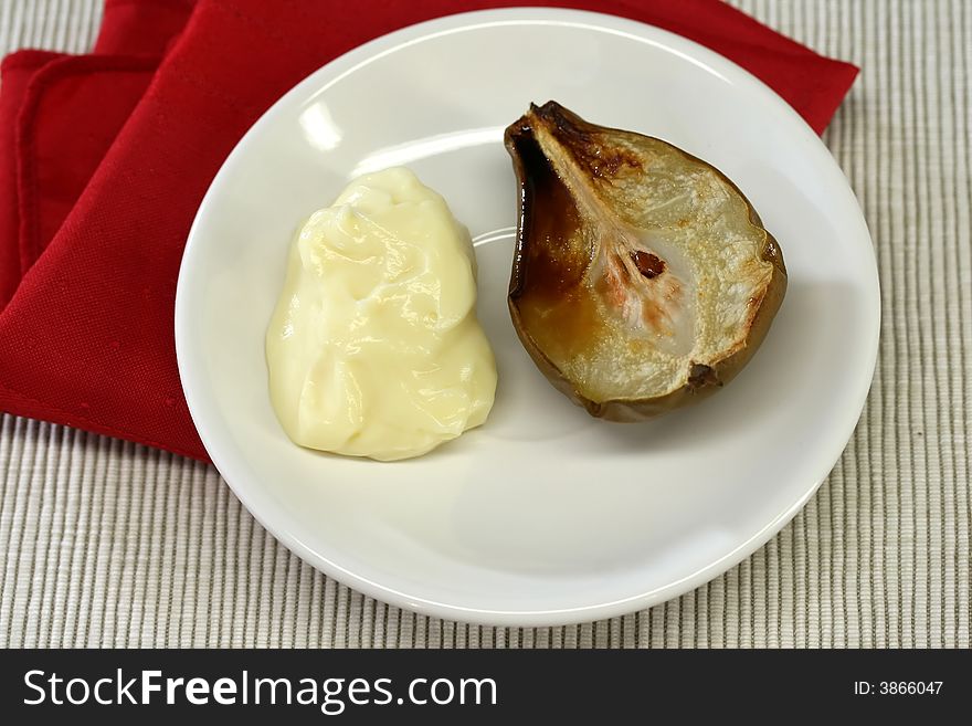 An oven baked pear and custard for dessert. An oven baked pear and custard for dessert