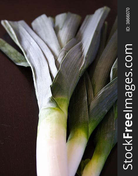 Bunch of leeks on a black background