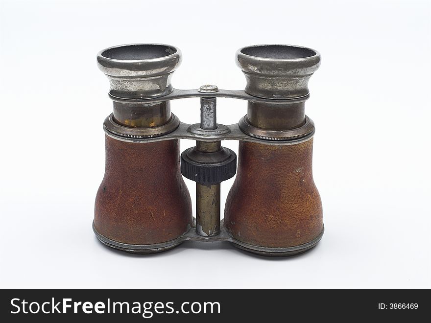 Old pair of binoculars isolated on white background. Old pair of binoculars isolated on white background