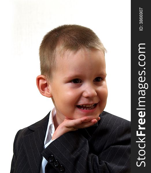 Smiling tot in gray coat and white shirt