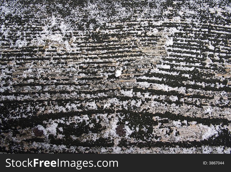 Black wood grain texture with thin snow texture