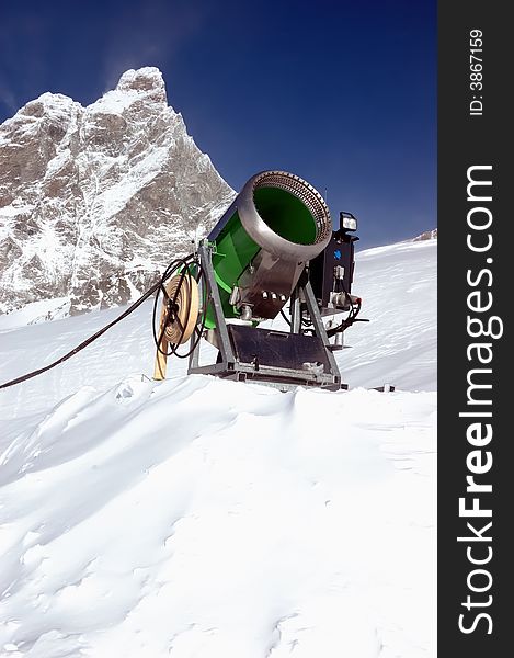 Snow-gun on a ski slope , matterhorn mountain ski resort