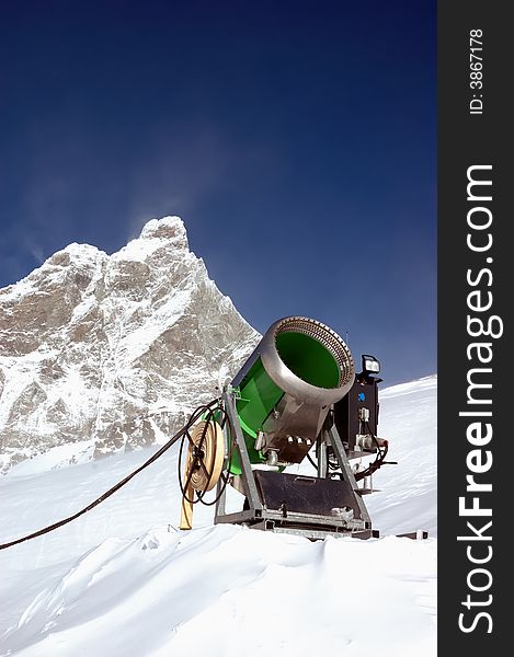 Snow-gun on a ski slope , matterhorn mountain ski resort