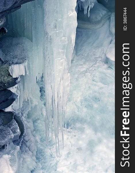 Detail of some frozen icicles on a waterfall in winter. Detail of some frozen icicles on a waterfall in winter.