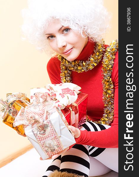 Beautiful young woman with gifts celebrating christmas. Beautiful young woman with gifts celebrating christmas