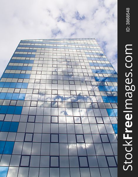 Modern tall building and clouds over it. Modern tall building and clouds over it